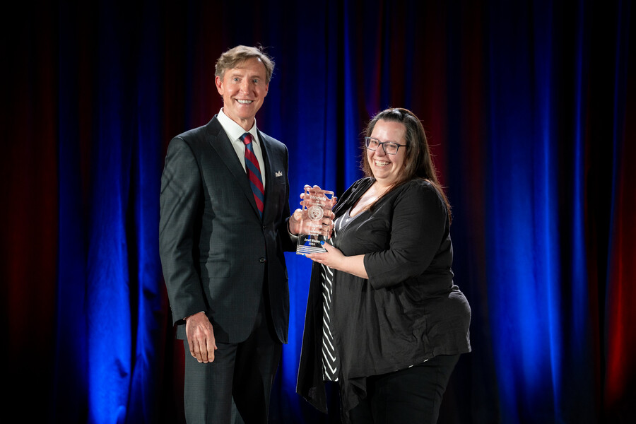 Jameson onstage with awardee Janell Wiseley