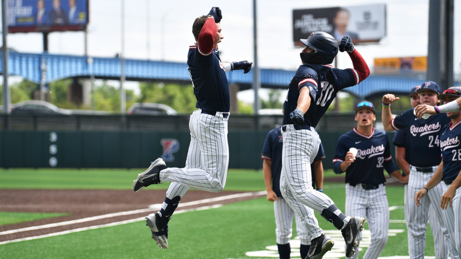 Wyatt Henseler and a team jump and bash arms after a big play.