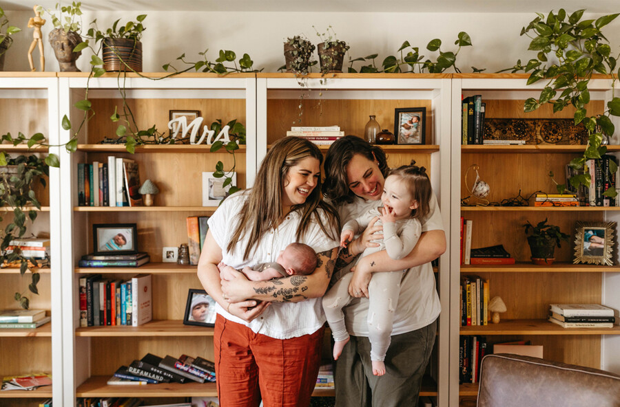 Ashlee Rineer (right) is holding Eleanor who is two years old this month and her partner Lauren (left) is holding Edie.