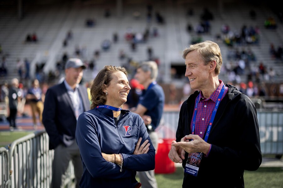 Alanna Wren, T. Gibbs Kane, Jr. W’69 Director of Athletics and Recreation, chatted with Penn President J. Larry Jameson at the Penn Relays.