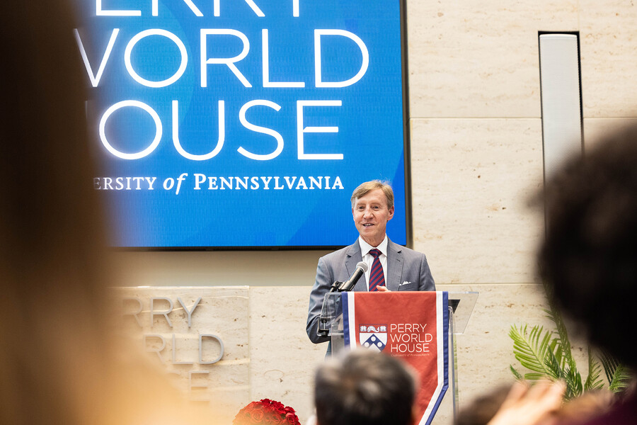 Penn President J. Larry Jameson at the podium speaking at Perry World House.