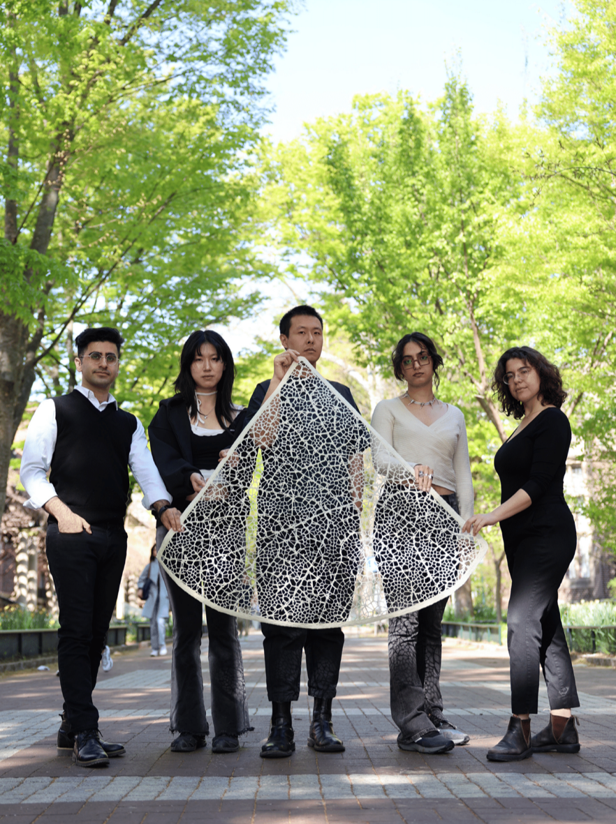Five members of The team at Weitzman’s DumoLab Research with one of the bio-based shingles.