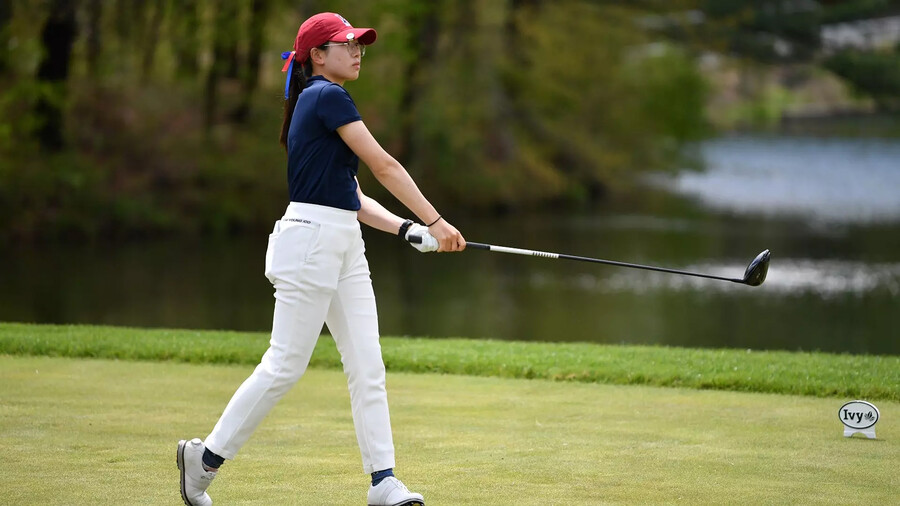 Julie Shin watches the ball after a swing during a match.