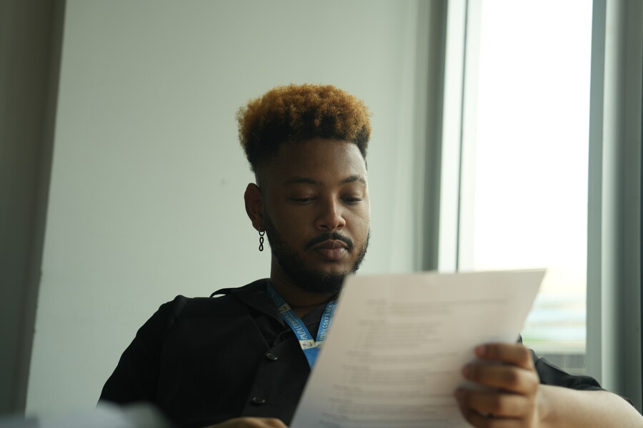 Timethius Terrell reading a document.