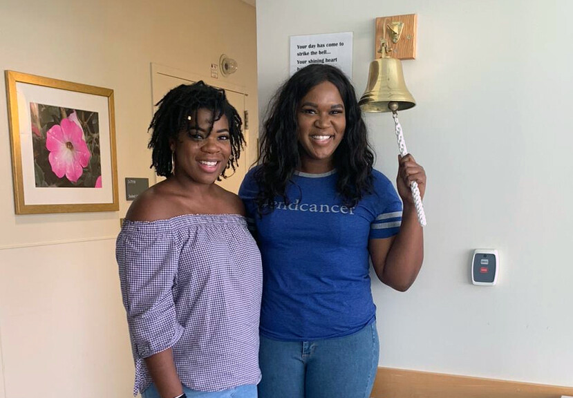 Bethany (left) and Brooklyn Olumba, Brooklyn is ringing the Penn Medicine bell.