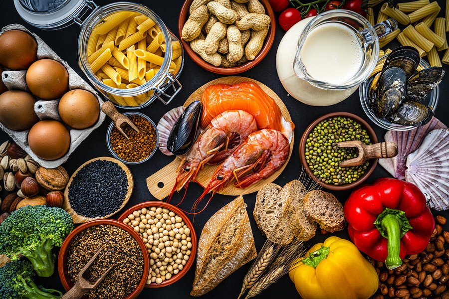 A table of common food allergens including shellfish, peanuts, legumes, eggs, and milk.
