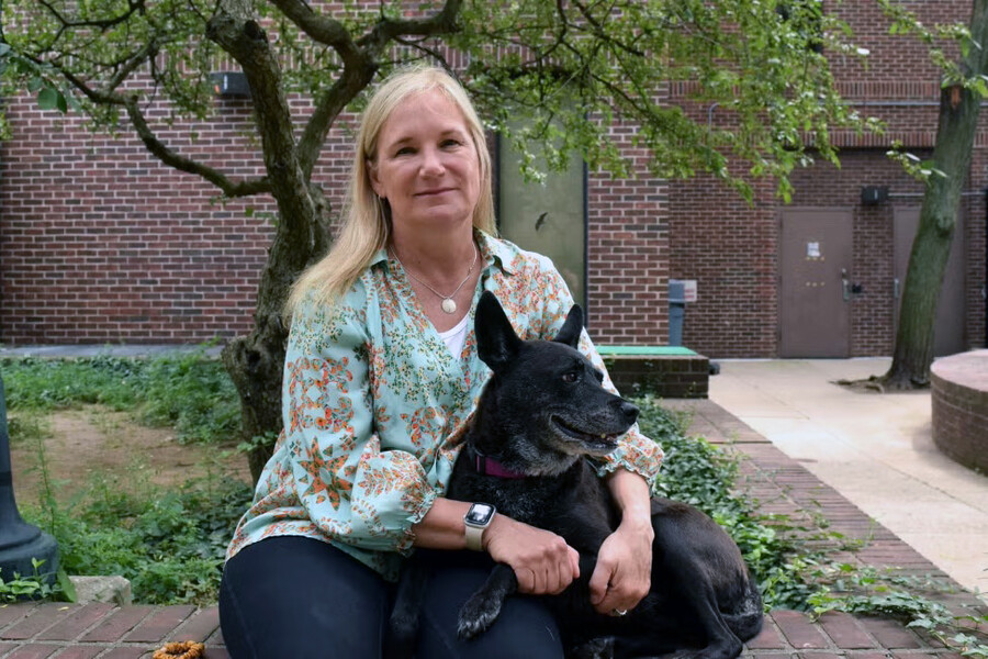 Elizabeth Mauldin with her dog Little Dove outside of Penn Vet.