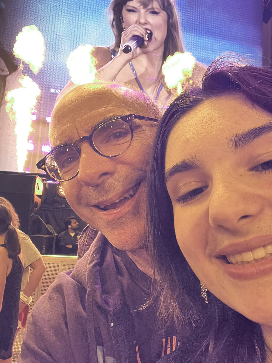Joe Romm and his daughter at a Taylor Swift concert.