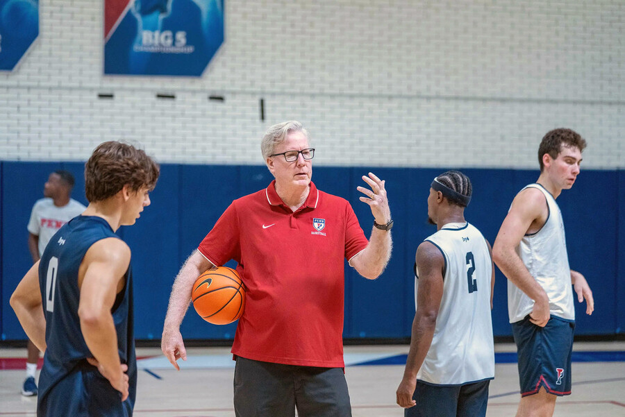 Fran McCaffery speaks with players during practice.