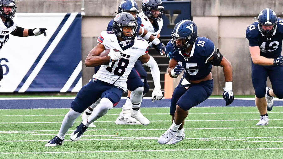 Jared Richardson runs with the ball against Yale.