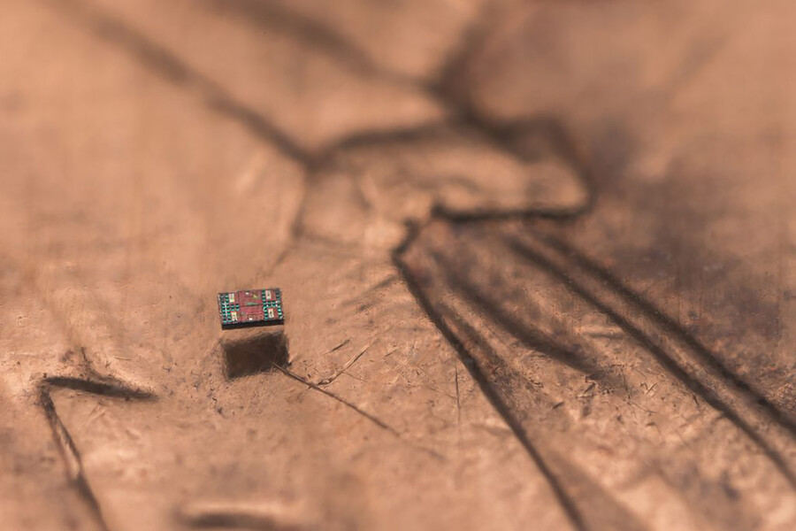 A microscopic robot on a U.S. penny for scale.