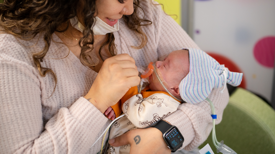 Pamela Collins holding her baby son.