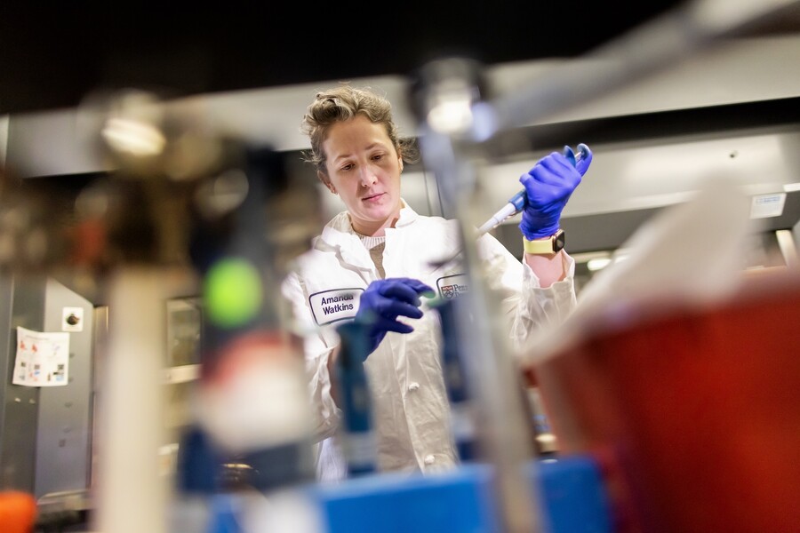 Amanda Watkins pipets nanoparticles.