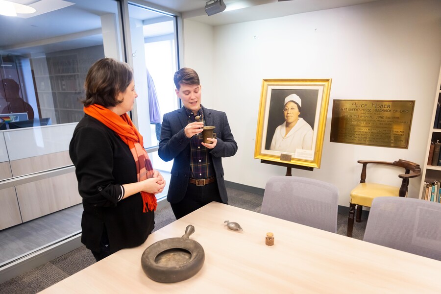 Meg Roberts and Jessica Martucci looking at nursing artifacts from the Revolutionary War.