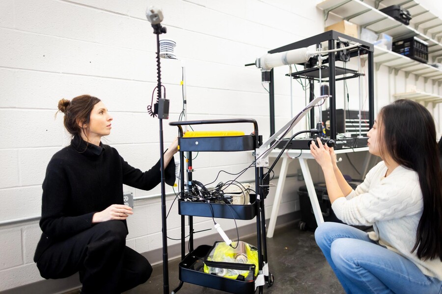 Dorit Aviv and Zhan Shi preparing the lab’s mobile weather station for deployment in Philadelphia. 