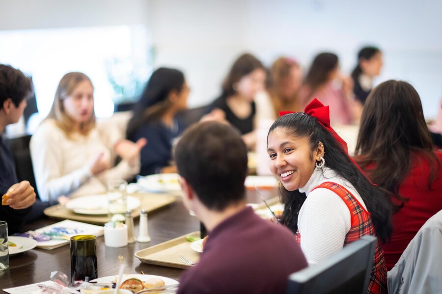 Students in a class discussing “Shakespeare in Love” over lunch.