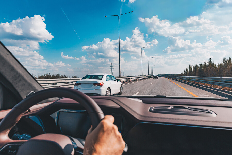 View of a highway from inside a car.