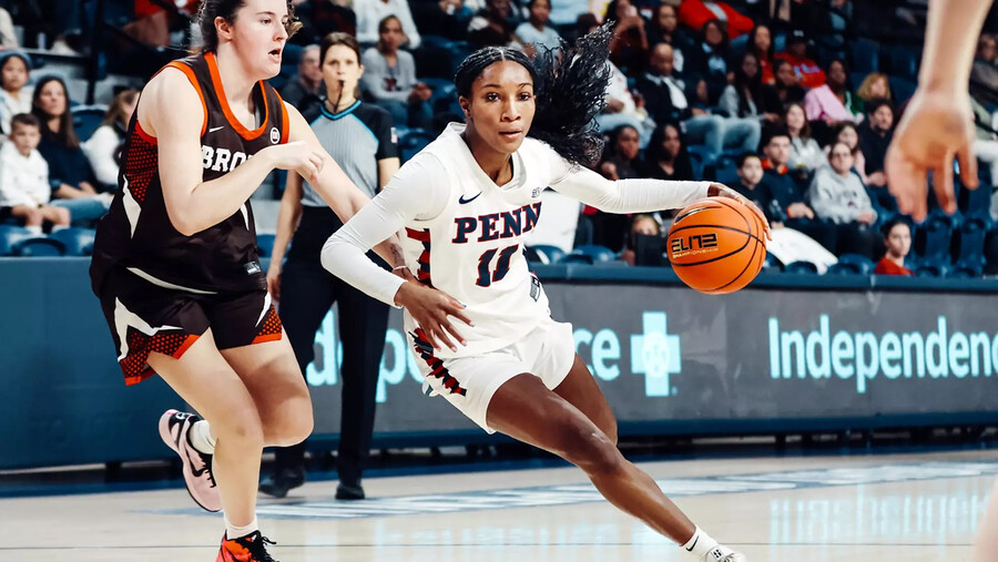 Simone Sawyer dribbles to the basketball against Brown.