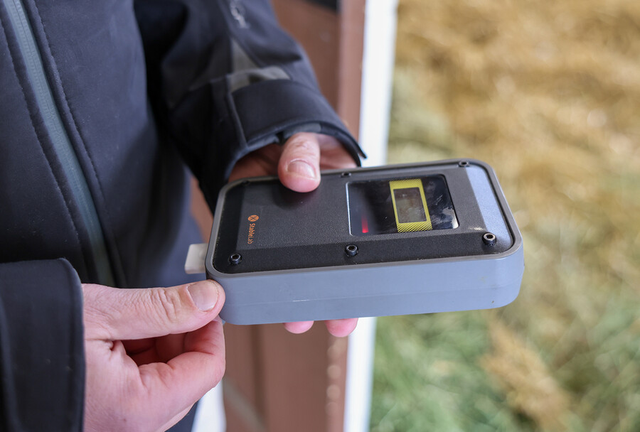Close-up of a handheld Stablelab device reading a sample.