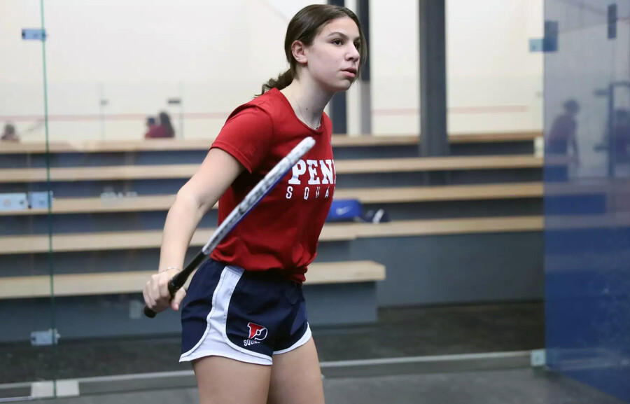 Jana Dweek prepares to swing at the ball during a match at the Penn Squash Center.
