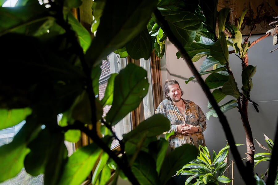 Nacho Sanguinetti poses between plants.