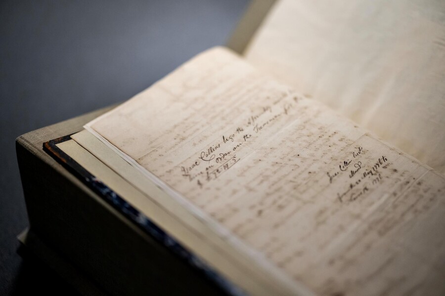 A close-up view of a handwritten book page.