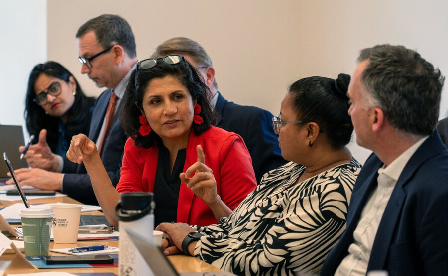 People in a discussion at Perry World House.