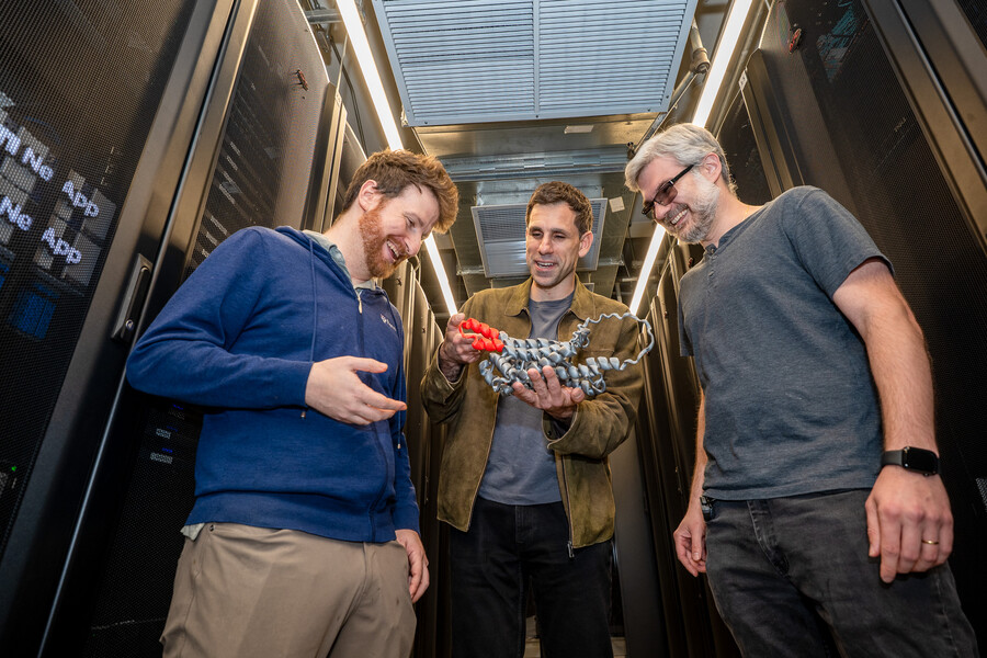 Jacob R. Gardner, César de la Fuente and Marcelo Torres, holding a 3D-printed example of the kind of antibiotic peptide they generated