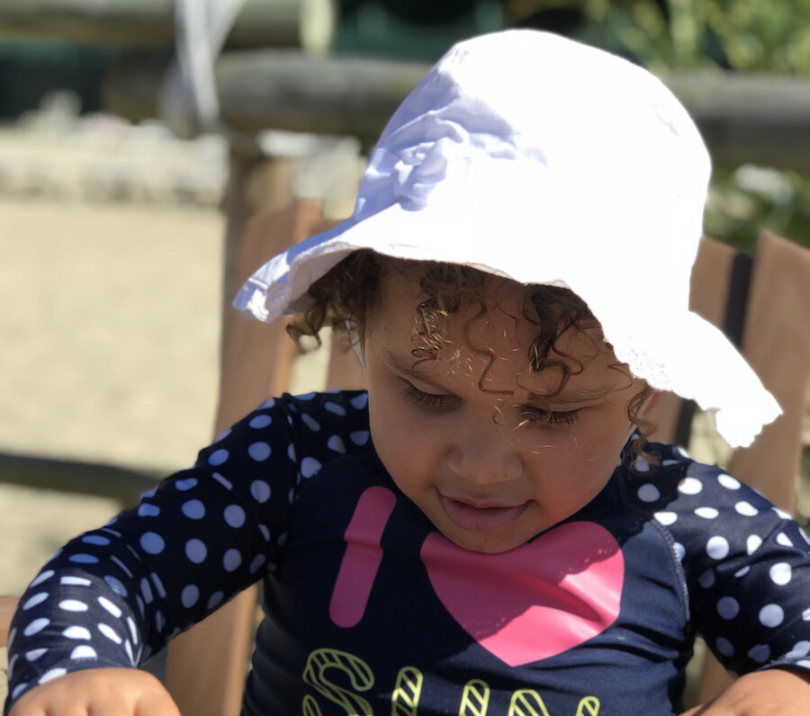 A child wearing a sun hat.