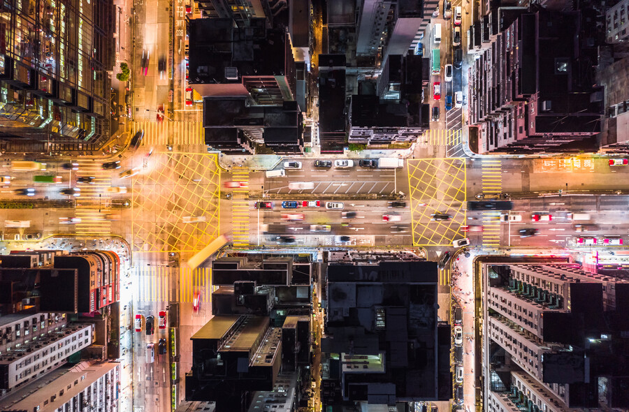 Aerial view of city streets and traffic.