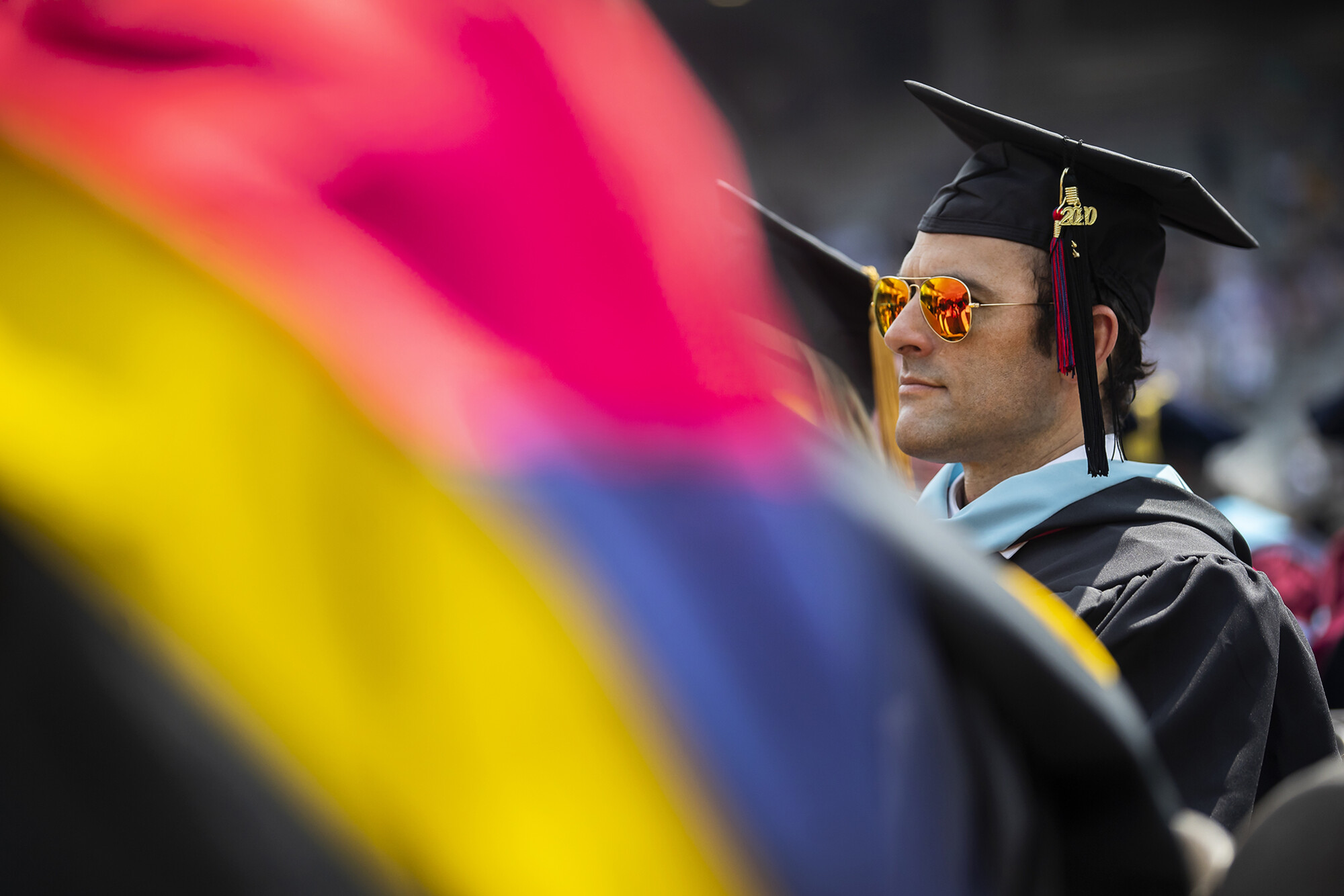 graduate sits at franklin field
