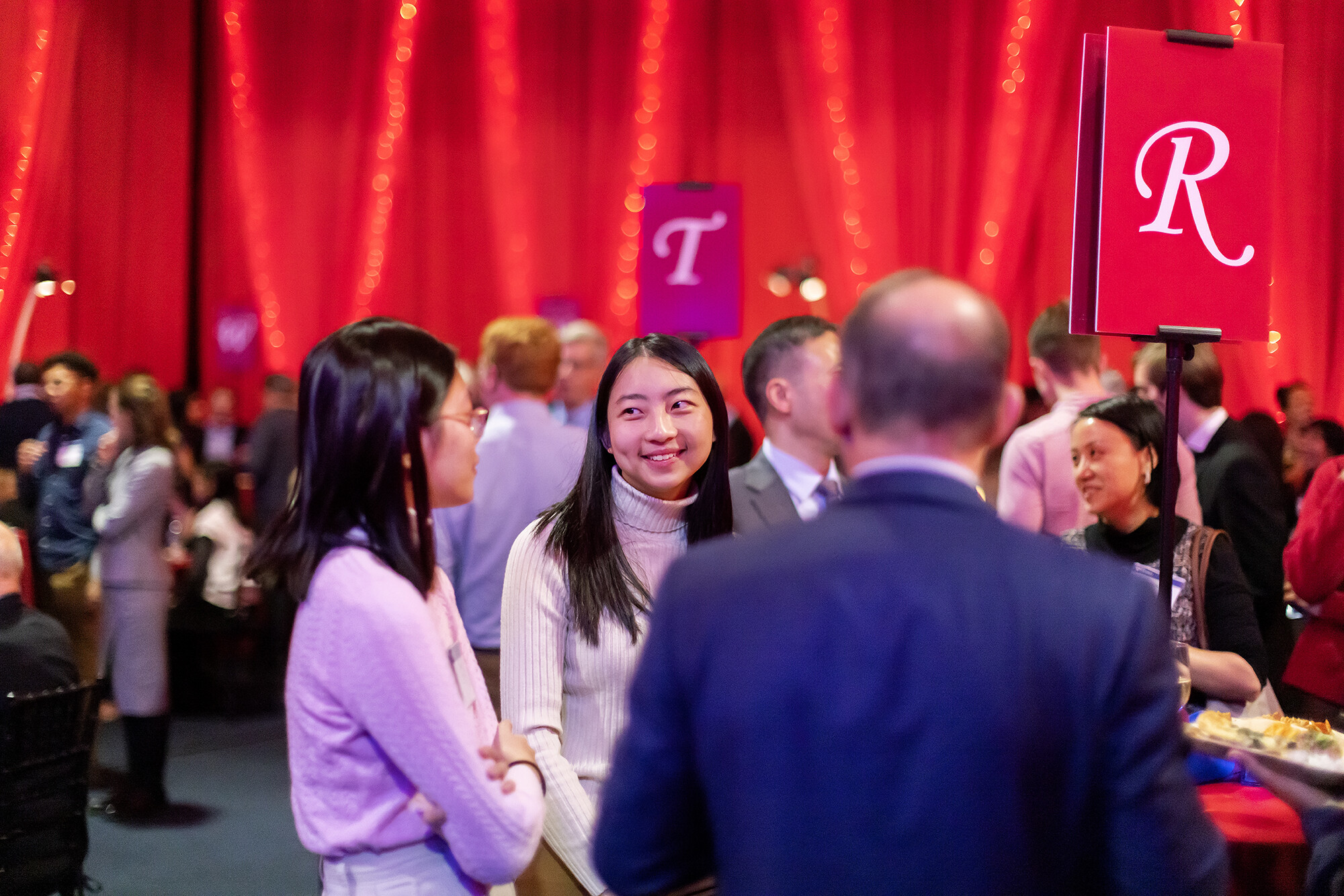 Students chat at table at scholarship celebration