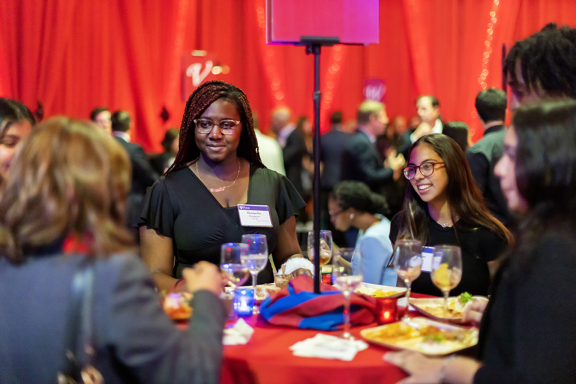 Students chat at table at scholarship celebration