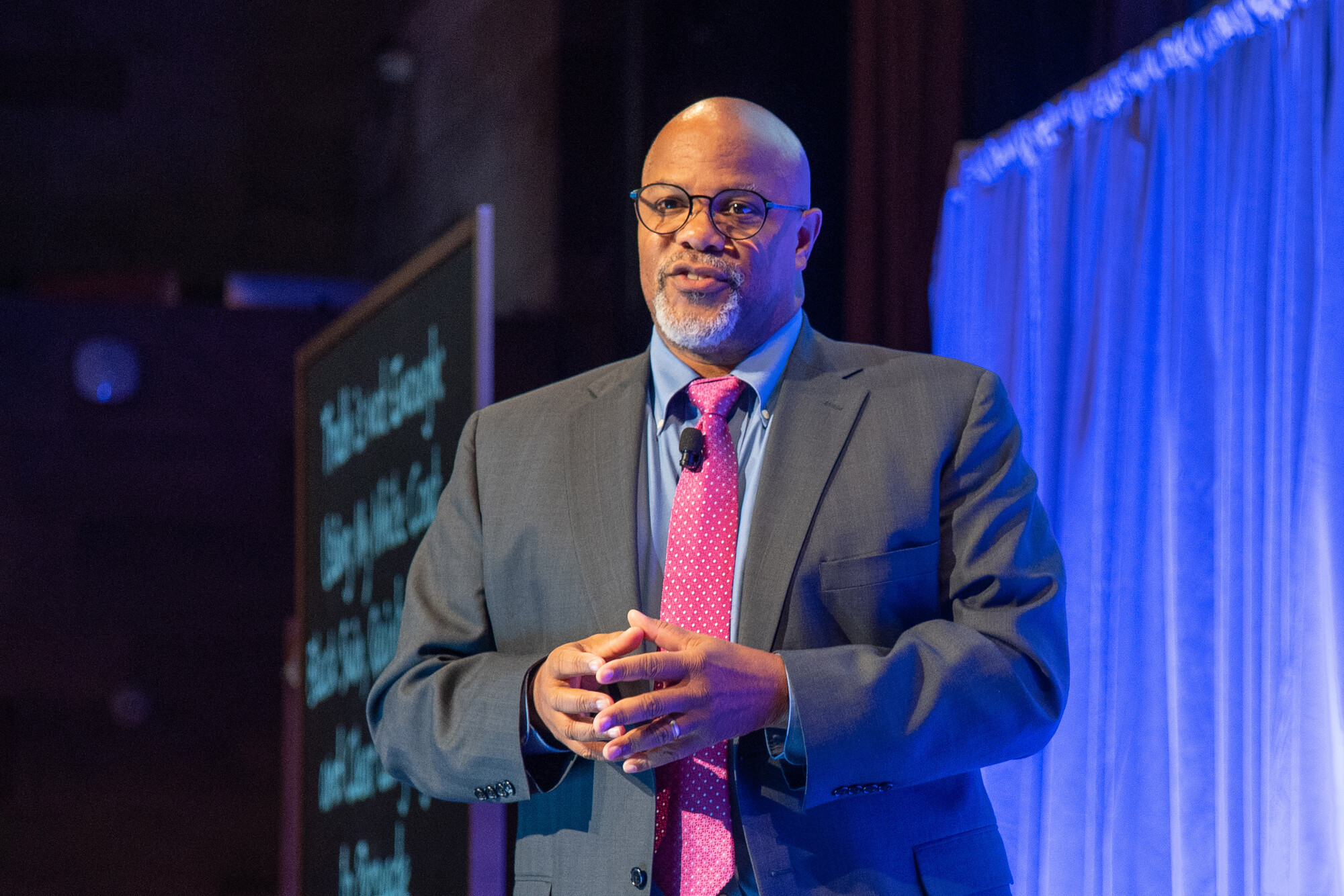 Kevin Johnson speaks on stage
