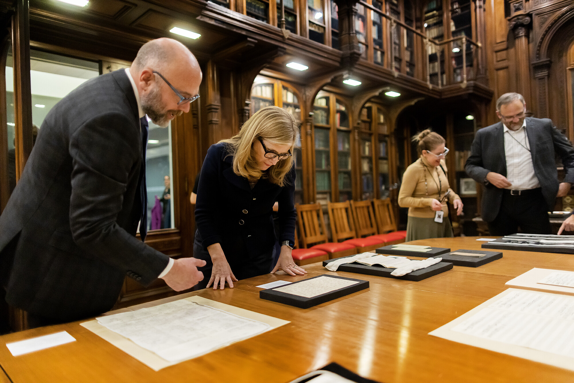 liz magill looking at orchestra archive items