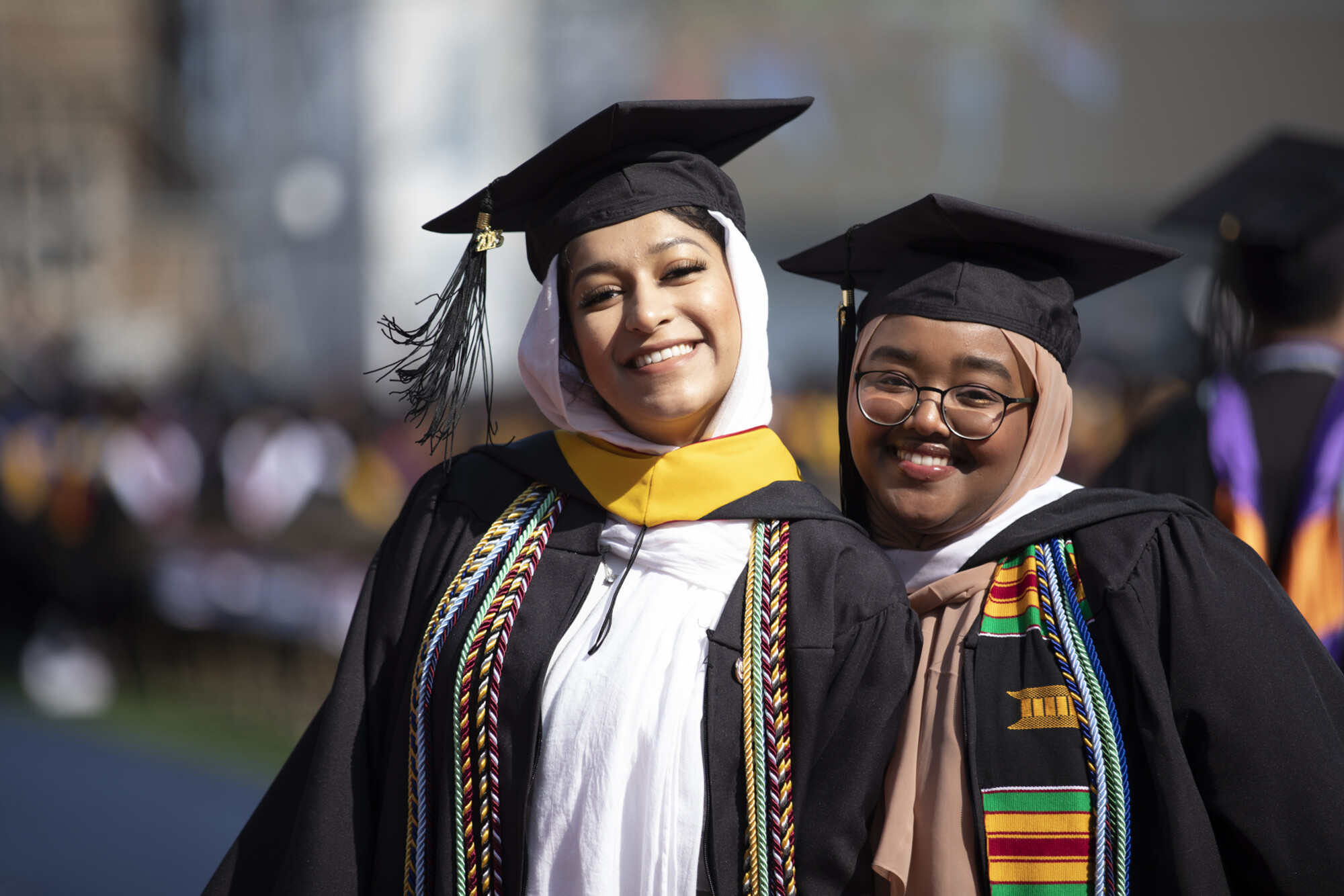 students walk into franklin field during commencement