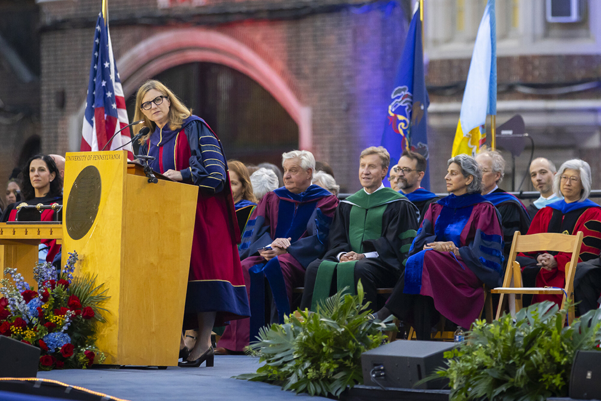 penn president liz magill speaks at the podium during convocation