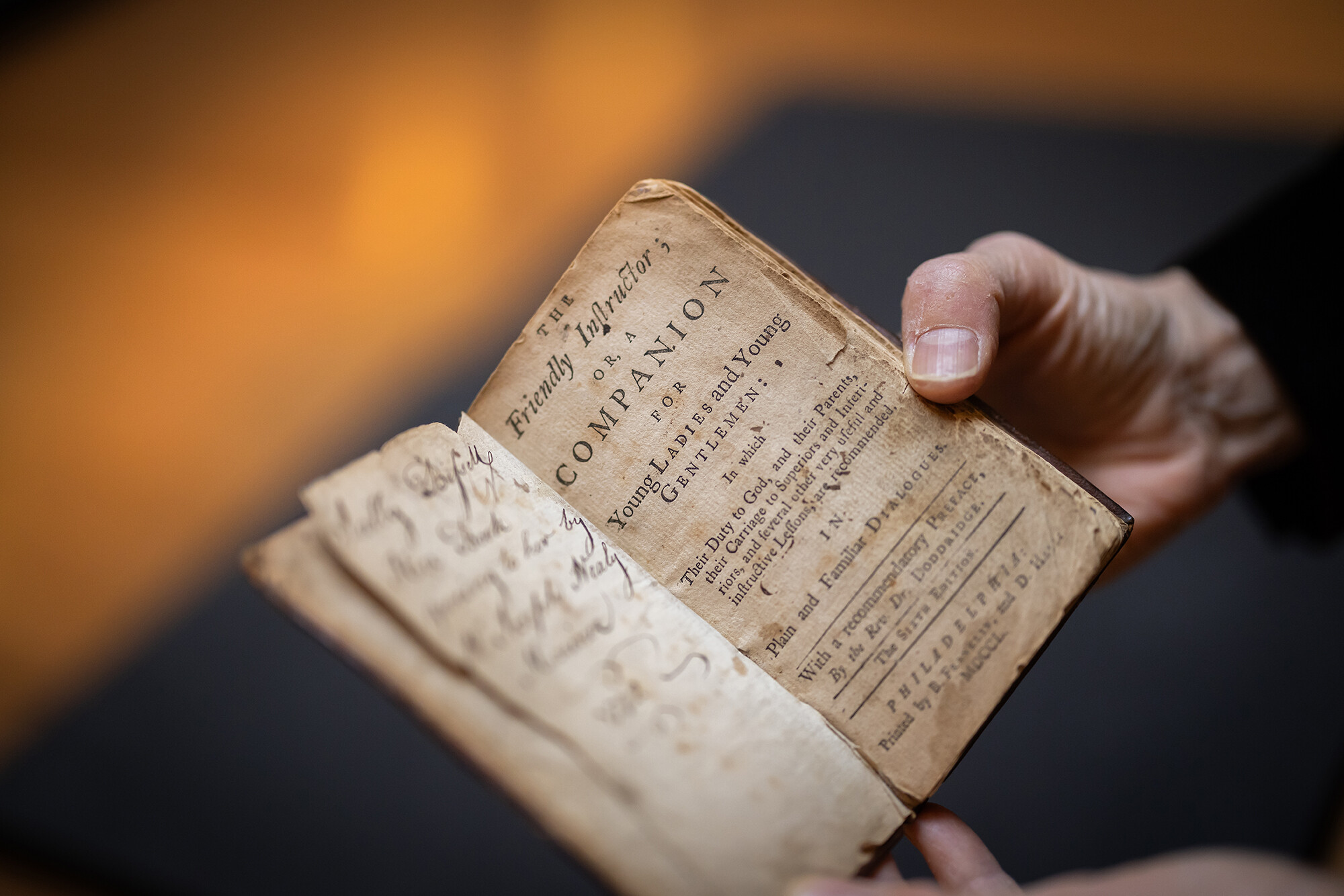 A historic book titled The Friendly Instructor’s Companion.