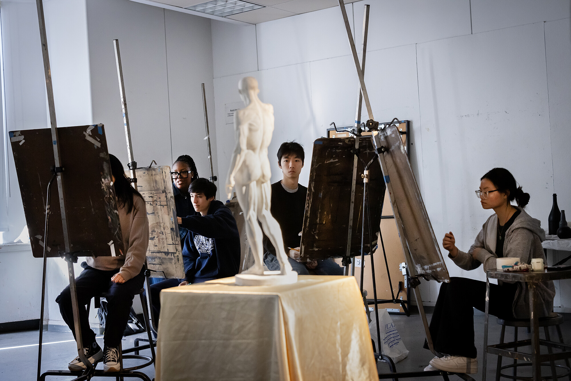 students draw a figure still life