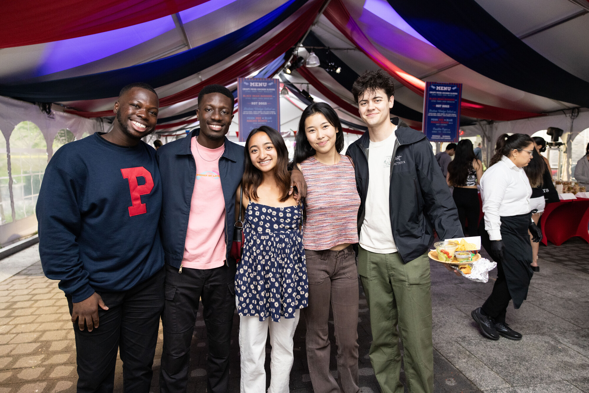 students smile for photo at carnival