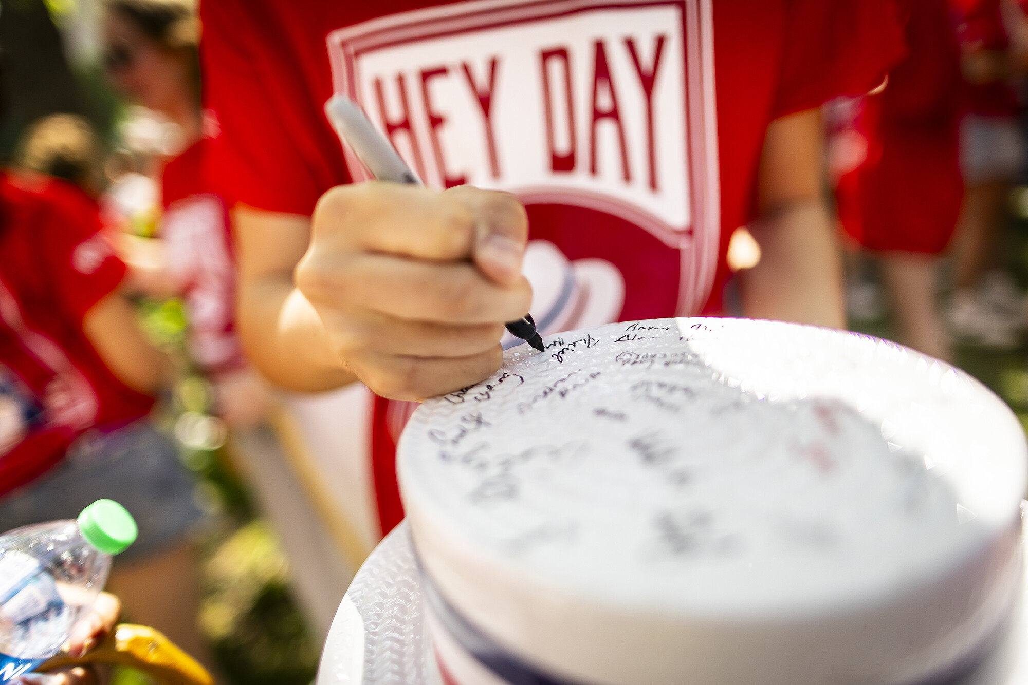 signing hats at hey day