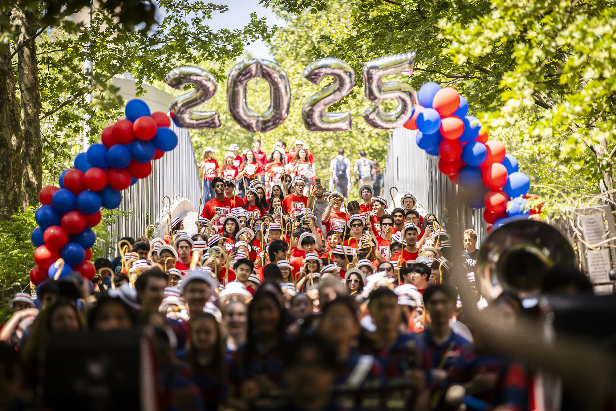 Students walking over the 38th bridge during hey day celebration