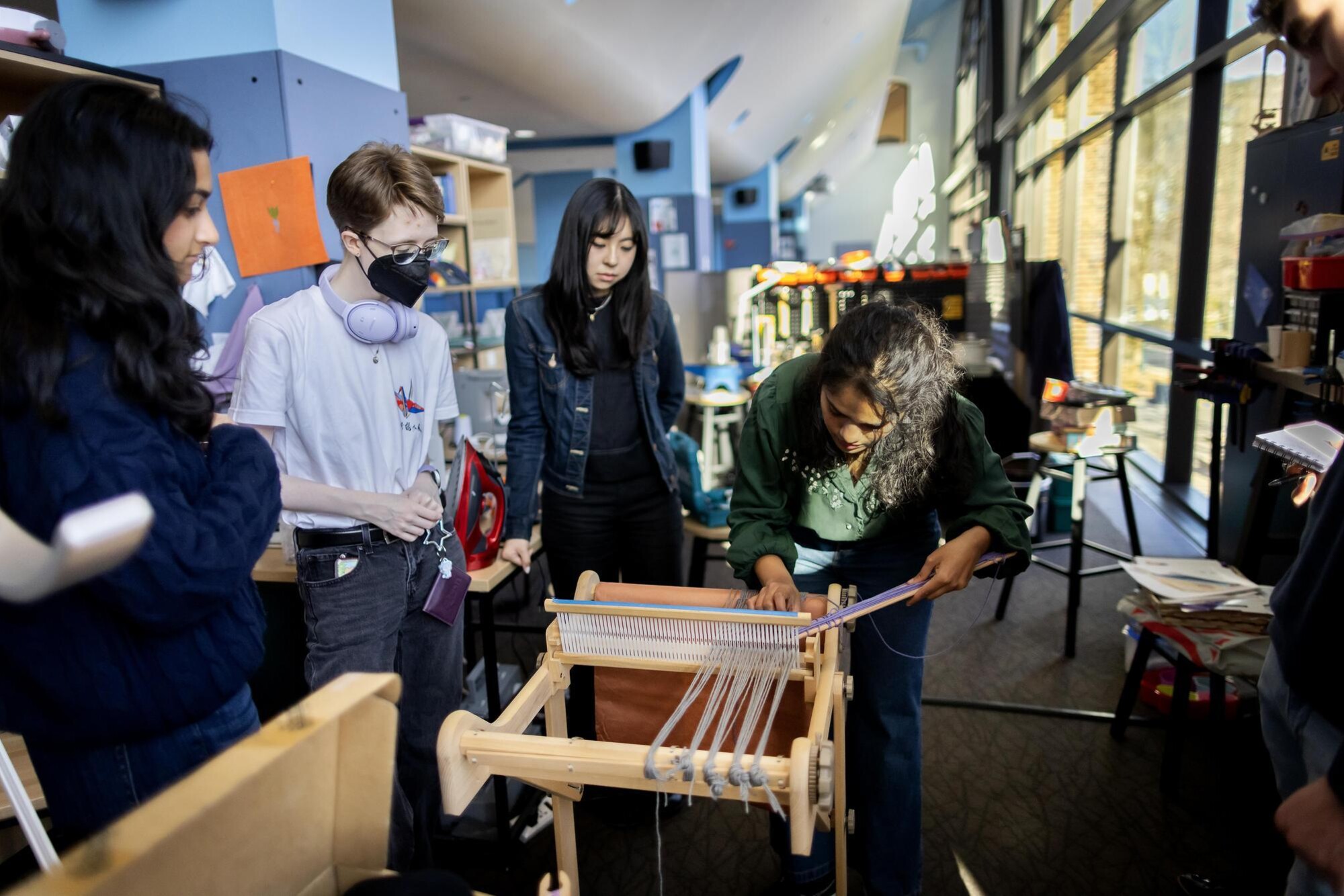 Students working on a loom at Penn’s Education Commons.
