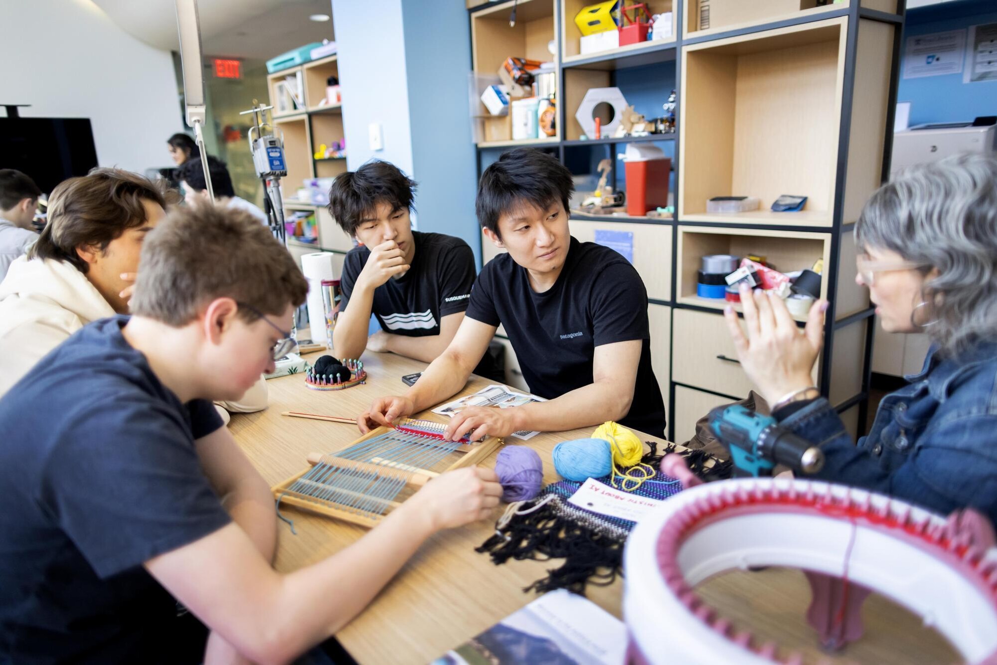 Students working on a loom at Penn’s Education Commons.