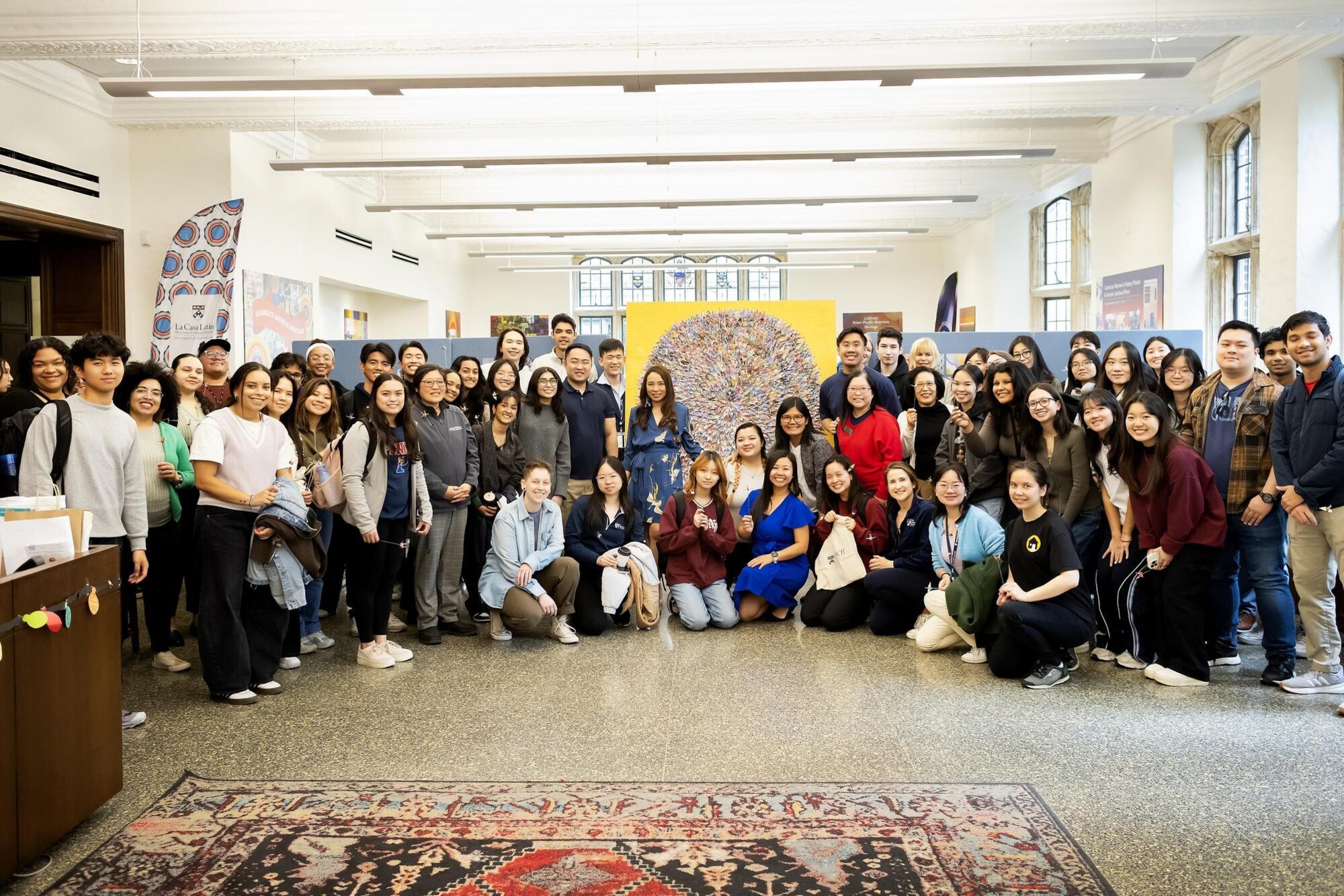 The group of people who attended the PAACH mural unveiling at the ARCH building in front of the mural.
