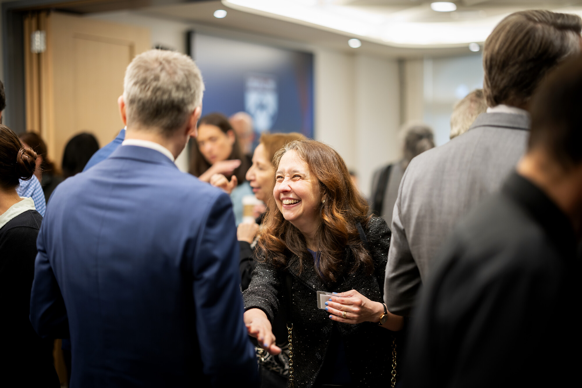 Lia Howard smiles and mingles with other guests.