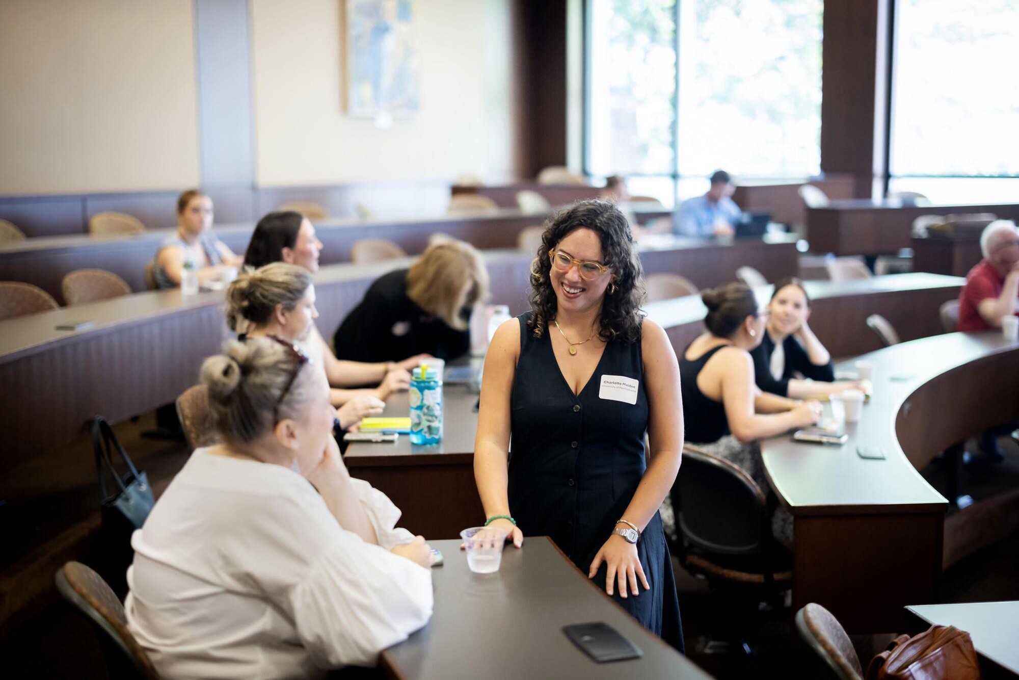 Charlotte Maiden speaking with another person in attendance of the op-ed writing workshop.