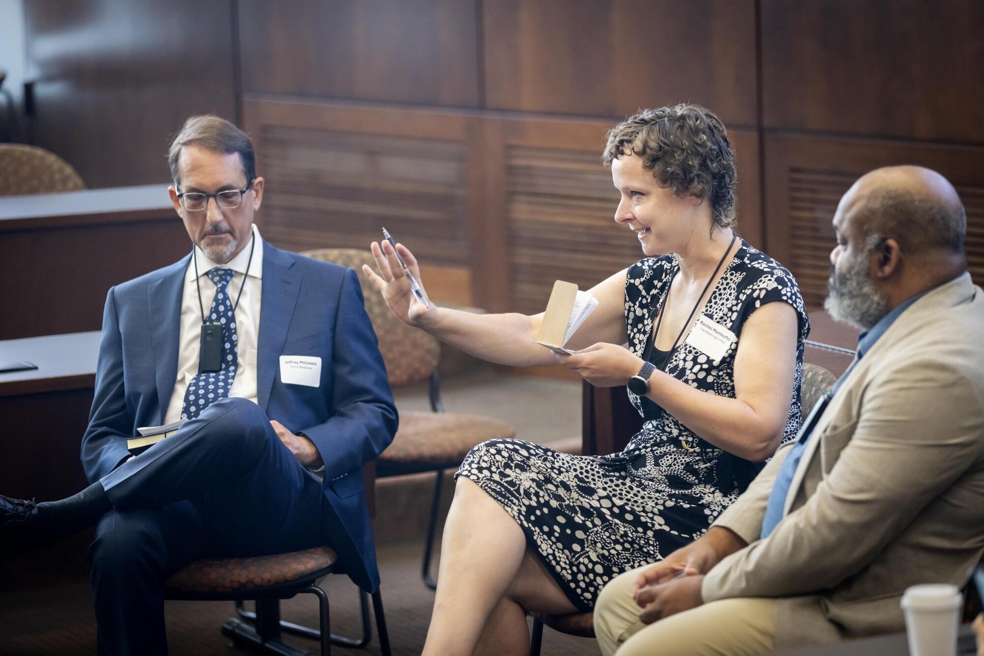 Three people at the UCOMMS op-ed writing workshop.