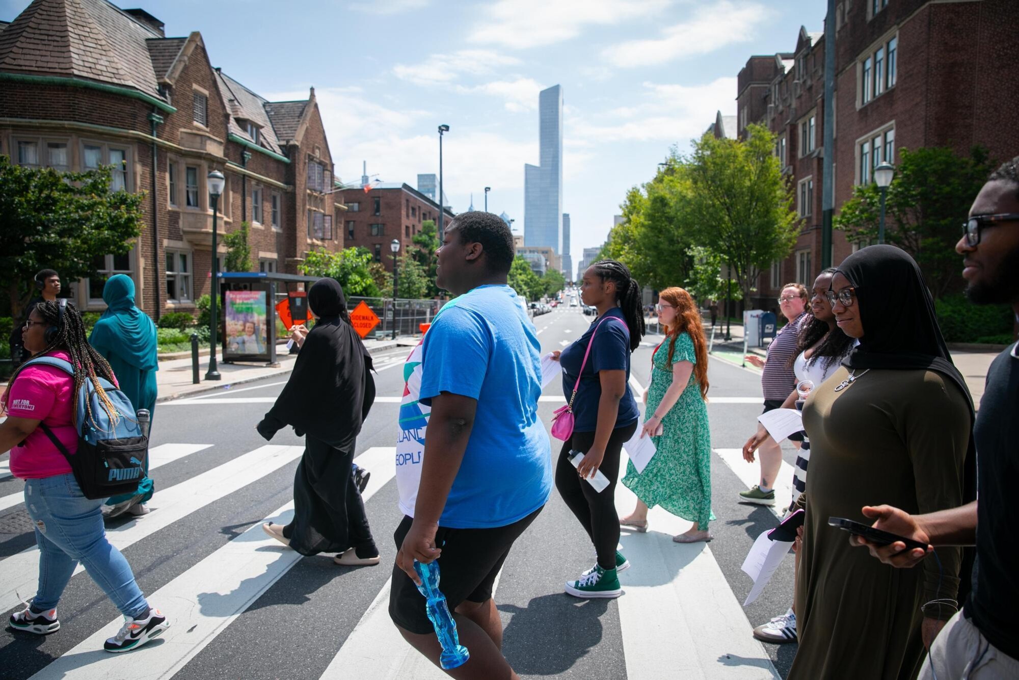 High school students in a crosswalk on a West Philly street.
