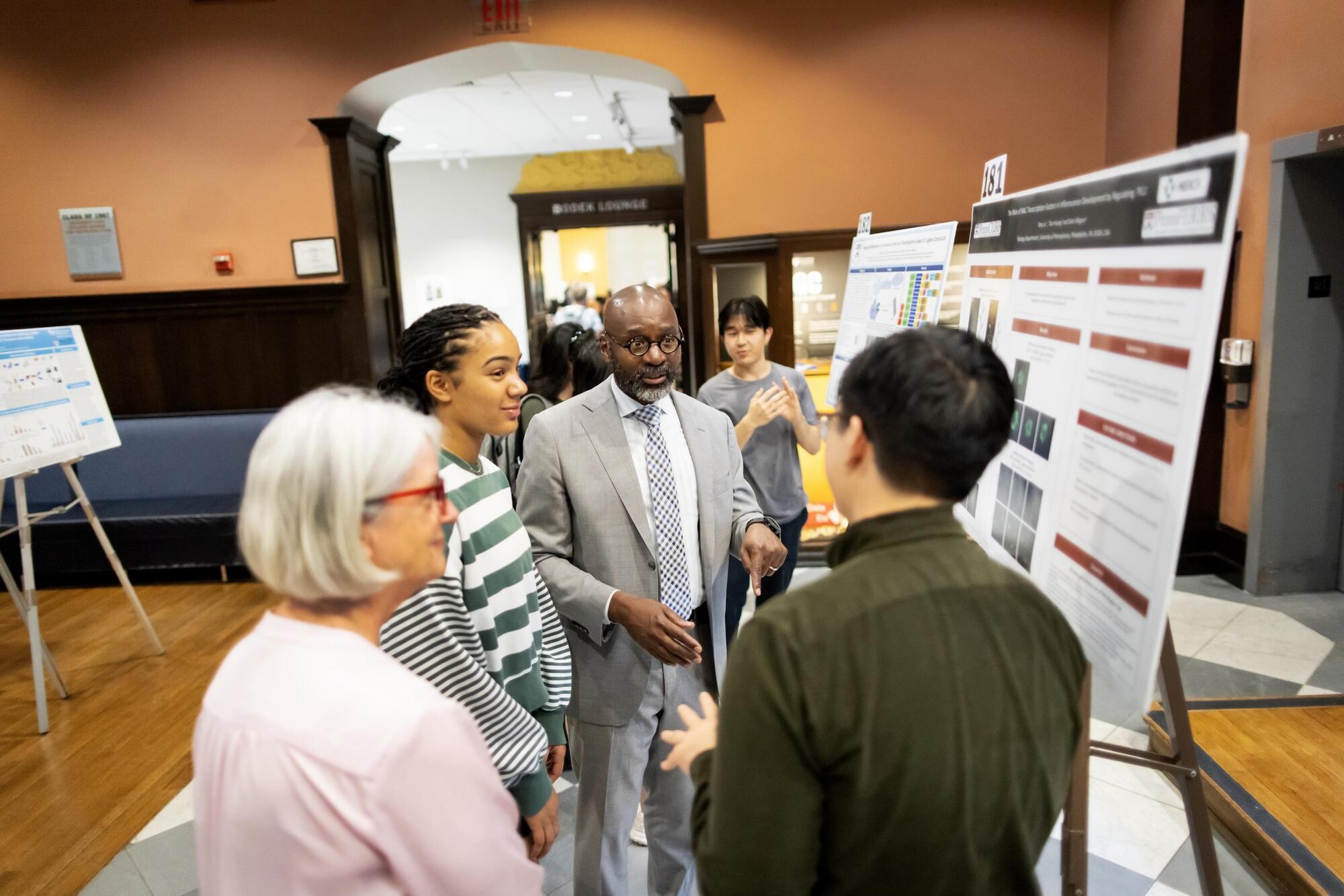 Provost John L. Jackson Jr. at the CURF Poster Expo speaking with a student.
